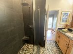 Hall bath with elegant tile shower